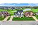 Expansive aerial view of a neighborhood with a golf course, lake and well kept lawns at 284 Chatham Hills Blvd, Westfield, IN 46074