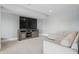 Finished basement rec room with plush carpeting and neutral colored walls at 284 Chatham Hills Blvd, Westfield, IN 46074