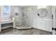 Bright bathroom features a glass shower, white cabinets, sleek fixtures, and a large mirror at 284 Chatham Hills Blvd, Westfield, IN 46074