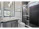 Modern bathroom with a gray vanity, marble countertop, and a glass-enclosed shower with black tiling at 284 Chatham Hills Blvd, Westfield, IN 46074