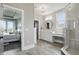 Bathroom with gray tile floors and vanity, featuring a corner shower and entry to the main bedroom at 284 Chatham Hills Blvd, Westfield, IN 46074