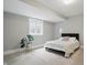 Bright bedroom features a large window, plant, and minimalist decor at 284 Chatham Hills Blvd, Westfield, IN 46074