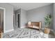 Bedroom featuring a crib, decor, and plant with carpet and light grey wall paint at 284 Chatham Hills Blvd, Westfield, IN 46074