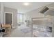 Neutral bedroom with bunk beds, desk and carpet flooring and large window at 284 Chatham Hills Blvd, Westfield, IN 46074