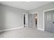 Cozy bedroom featuring neutral walls and carpet, with doorways leading to other rooms at 284 Chatham Hills Blvd, Westfield, IN 46074
