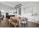 Inviting dining area with modern light fixture, connecting seamlessly to a stylish kitchen at 284 Chatham Hills Blvd, Westfield, IN 46074