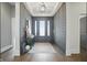 Stylish entryway featuring gray shiplap walls, wood floors, and modern decor accents at 284 Chatham Hills Blvd, Westfield, IN 46074