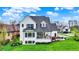 Backyard patio area featuring modern patio set and fire pit area for a new construction home at 284 Chatham Hills Blvd, Westfield, IN 46074