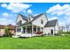Spacious home features a large backyard, fire pit, and covered patio at 284 Chatham Hills Blvd, Westfield, IN 46074