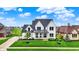 Beautiful home features a manicured lawn and covered front porch at 284 Chatham Hills Blvd, Westfield, IN 46074