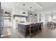 Bright kitchen featuring a center island with barstool seating and modern lighting fixtures at 284 Chatham Hills Blvd, Westfield, IN 46074