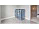 Laundry room featuring blue front-loading washer and dryer set on a patterned tile floor at 284 Chatham Hills Blvd, Westfield, IN 46074