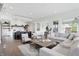 Open-concept view showcasing the seamless transition from the living room to the stylish kitchen at 284 Chatham Hills Blvd, Westfield, IN 46074