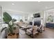 Cozy living room with a fireplace, comfortable seating, and hardwood floors at 284 Chatham Hills Blvd, Westfield, IN 46074