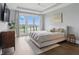 Spacious main bedroom featuring a tray ceiling, hardwood floors, and balcony with beautiful views at 284 Chatham Hills Blvd, Westfield, IN 46074