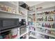 Organized pantry with ample shelving and countertop space for storage and food preparation at 284 Chatham Hills Blvd, Westfield, IN 46074