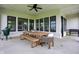 Spacious covered patio features a large dining table, bench, and chairs at 284 Chatham Hills Blvd, Westfield, IN 46074