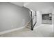 Staircase leading to a carpeted basement space with painted gray walls and trim at 284 Chatham Hills Blvd, Westfield, IN 46074