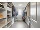 Organized walk-in closet featuring custom shelving and storage solutions for clothing and accessories at 284 Chatham Hills Blvd, Westfield, IN 46074