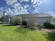 Exterior view of home featuring well-maintained lawn and mature landscaping and plantings at 2904 Inverrary Ct, Indianapolis, IN 46234