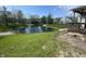 Backyard featuring beautiful pond and a well-maintained lawn, creating a peaceful outdoor oasis at 2904 Inverrary Ct, Indianapolis, IN 46234