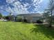 Exterior view of home featuring well-maintained lawn and mature landscaping and plantings at 2904 Inverrary Ct, Indianapolis, IN 46234