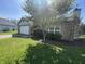 Cozy single-Gathering home with a beautiful flowering tree and a well-maintained lawn on a sunny day at 2904 Inverrary Ct, Indianapolis, IN 46234
