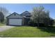 Charming home with a well-manicured lawn, a two-car garage, and attractive brick and siding accents at 2904 Inverrary Ct, Indianapolis, IN 46234