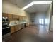Kitchen with a skylight, stainless steel appliances, and wood cabinets at 2904 Inverrary Ct, Indianapolis, IN 46234