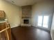 Living room featuring a large brick fireplace and natural light at 2904 Inverrary Ct, Indianapolis, IN 46234