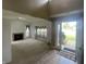 Inviting living room with a fireplace, large windows, and tile flooring as it transitions from entry at 2904 Inverrary Ct, Indianapolis, IN 46234