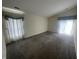 Spacious living room featuring plush carpeting, large windows, and vaulted ceilings at 2904 Inverrary Ct, Indianapolis, IN 46234