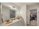 Bright bathroom featuring a double sink vanity and a tiled walk-in shower, plus a walk-in closet at 3235 Myrtle Dr, Lapel, IN 46051