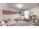 Comfortable bedroom is decorated with personal touches and features natural light and ample storage space at 3235 Myrtle Dr, Lapel, IN 46051
