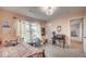 Cozy bedroom with a window, desk, and unique decorations creating a comfortable, personalized space at 3235 Myrtle Dr, Lapel, IN 46051
