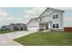Charming two-story home boasts a welcoming facade, manicured lawn, and a convenient two-car garage at 3235 Myrtle Dr, Lapel, IN 46051