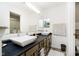 Bathroom featuring double vanity sinks, modern fixtures, and neutral decor at 324 Palmyra Dr, Indianapolis, IN 46239