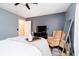 Cozy bedroom featuring stylish decor, a comfortable chair, and a large window at 324 Palmyra Dr, Indianapolis, IN 46239