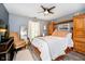 Bedroom with wooden furniture, a window, and a queen bed at 324 Palmyra Dr, Indianapolis, IN 46239