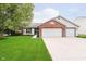Charming single Gathering home with a well-manicured lawn and two-car garage at 324 Palmyra Dr, Indianapolis, IN 46239