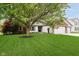 Well-manicured lawn complements this home's exterior featuring a brick facade and attached garage at 324 Palmyra Dr, Indianapolis, IN 46239