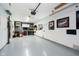 Clean and functional garage space with storage solutions and decorative car art at 324 Palmyra Dr, Indianapolis, IN 46239