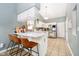 Bright kitchen with white cabinets, stainless steel appliances, and barstool seating at 324 Palmyra Dr, Indianapolis, IN 46239