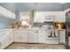 Bright kitchen with white cabinetry, stainless steel appliances, and a large window at 324 Palmyra Dr, Indianapolis, IN 46239