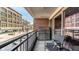 Inviting balcony space with outdoor seating overlooking a vibrant street and building at 333 Massachusetts Ave # 204, Indianapolis, IN 46204