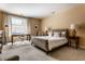Bright bedroom with large window, desk, and neutral decor at 333 Massachusetts Ave # 204, Indianapolis, IN 46204