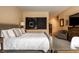 Comfortable bedroom with a king-size bed, accent chair, and stylish decor at 333 Massachusetts Ave # 204, Indianapolis, IN 46204