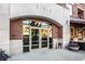 Stylish building entrance featuring double glass doors, brick accents, and modern architectural details at 333 Massachusetts Ave # 204, Indianapolis, IN 46204