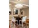 Cozy dining area featuring hardwood floors, modern lighting, and stylish decor accents at 333 Massachusetts Ave # 204, Indianapolis, IN 46204