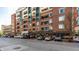 Brick building with commercial spaces and residential units, complemented by street parking at 333 Massachusetts Ave # 204, Indianapolis, IN 46204